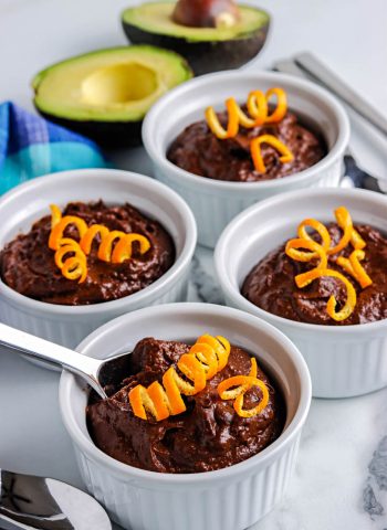 A close up picture of the finished Avocado Chocolate Pudding garnished with orange zest.