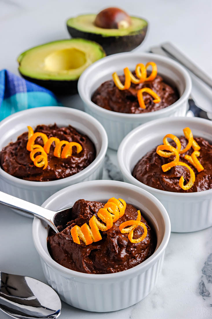 A close up picture of the finished Avocado Chocolate Pudding garnished with orange zest.