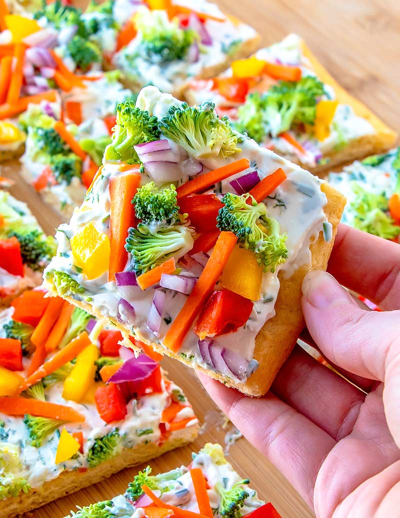 Crescent Roll Pizza loaded with broccoli, carrots and bell pepper.