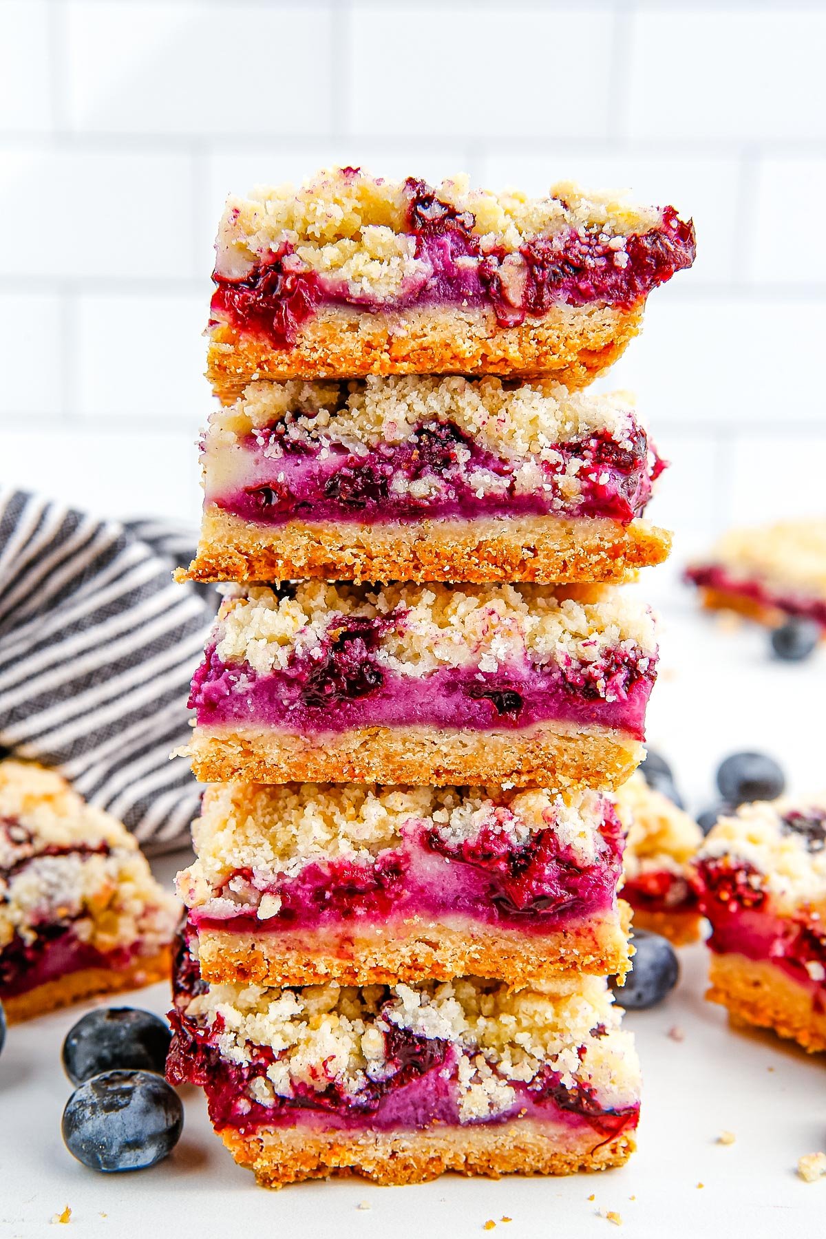 Five Blueberry Crumb Bars stacked on top of each other.