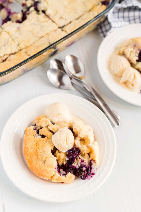 AN overhead picture of blueberry cobbler with ice cream.