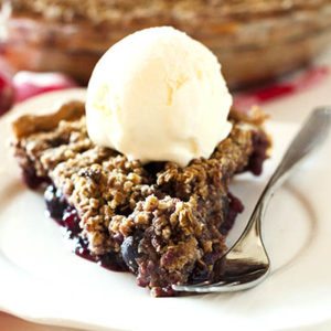 This Cherry Crumble Pie features summer's juiciest cherries covered in a crumble topping of oats, brown sugar and cinnamon.
