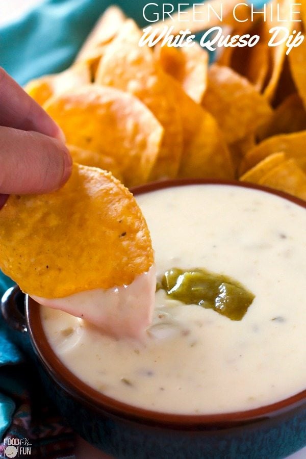 A tortilla chip dipping into this Queso Blanco.