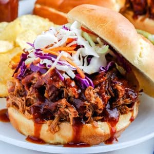 A up close view of the Pulled Pork on a roll with coslaw on top.