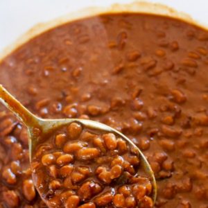 A closeup of a spoonful of Boston Baked Beans