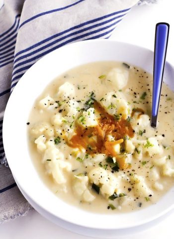 This Creamy Cauliflower Soup recipe is savory, cheesy, and filled with tender chunks of cauliflower plus all of the comforts of a home-cooked meal!