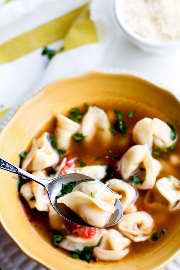 A spoonful of Tortellini Soup in a bowl