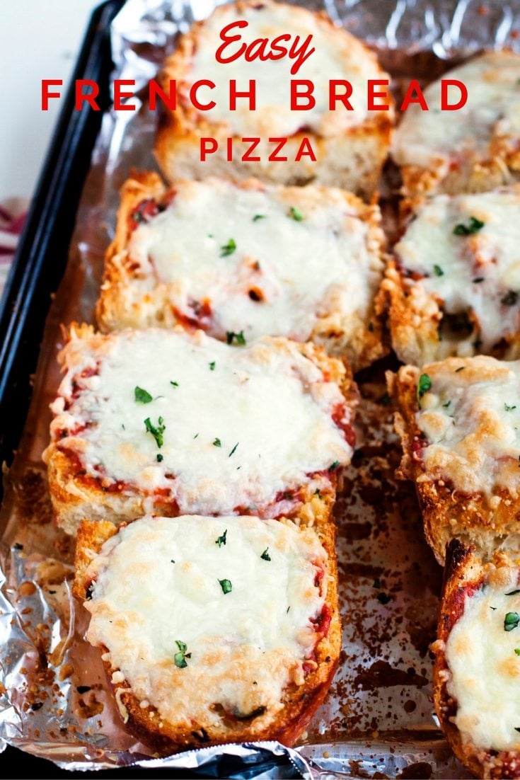 French bread pizza cut and on a baking sheet. 