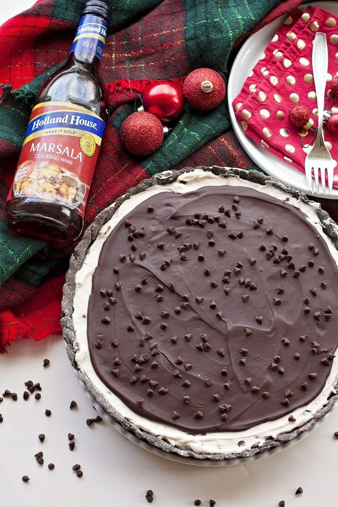 A chocolate cannoli tart with a bottle of Marsala Cooking Wine on the side 