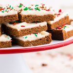 A close up picture gingerbread bars stacked on top of each other.