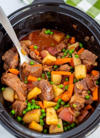 The finished beef stew inside of a slow cooker.