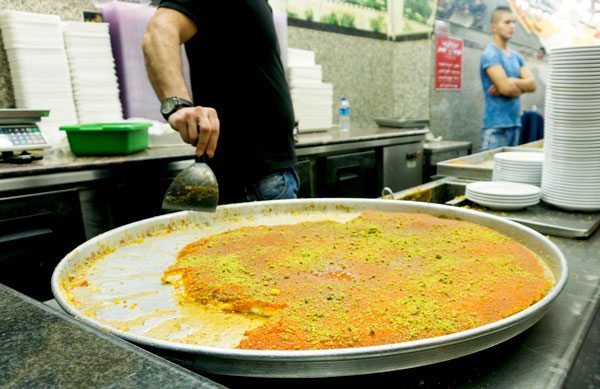 a cheese pastry soaked in syrup called Kanafeh