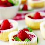 A close-up of a raspberry swirl cheesecake cupcakes on a plate