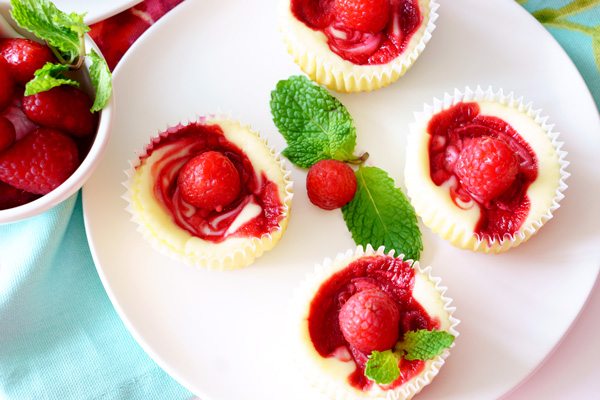 Top view of raspberry swirl cheesecake cupcakes