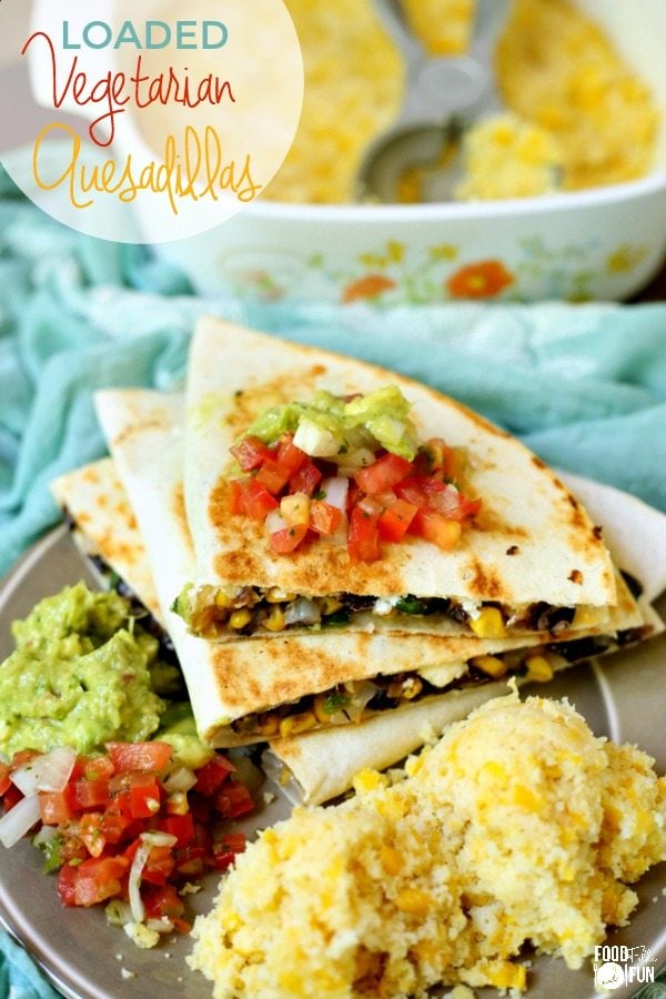 Loaded Vegetarian Quesadillas in a stack on a plate with text overlay for Pinterest