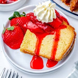 A slice of pound cake with strawberry topping.