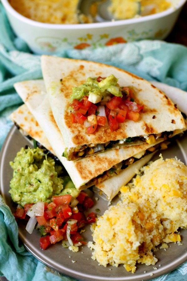 Easy Vegetarian Quesadillas on a plate with a side of guacamole and salsa