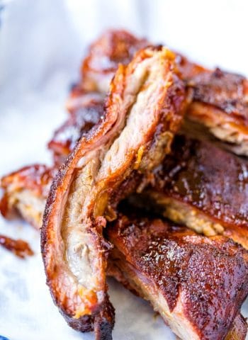 Sliced smoked ribs stacked together.
