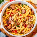 The finished pasta dish in a white pot.
