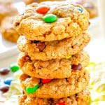A close up picture of Gluten Free Monster Cookies stacked on top of each other.