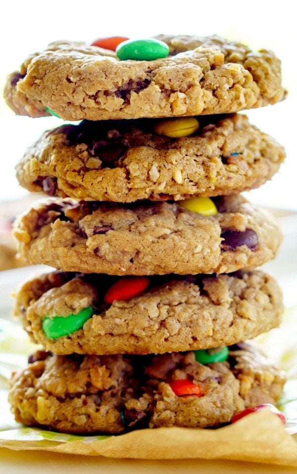 A stack of Monster cookies on a plate