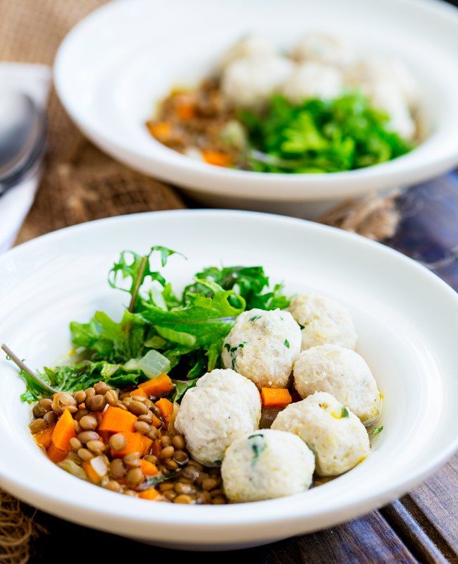 A bowl of lentil with kale and chicken meatballs