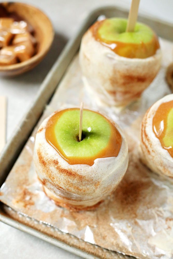 Disney Copycat Apple Pie Caramel Apples on a baking sheet