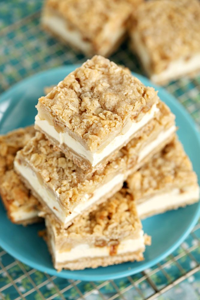 A stack of Apple Cheesecake Bars on a plate