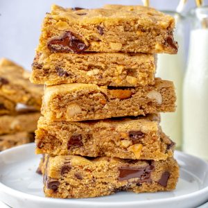 A close up picture of five peanut butter cookie bars stacked on top of each other.