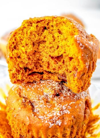 Two Pumpkin Muffins stacked on top of each other.