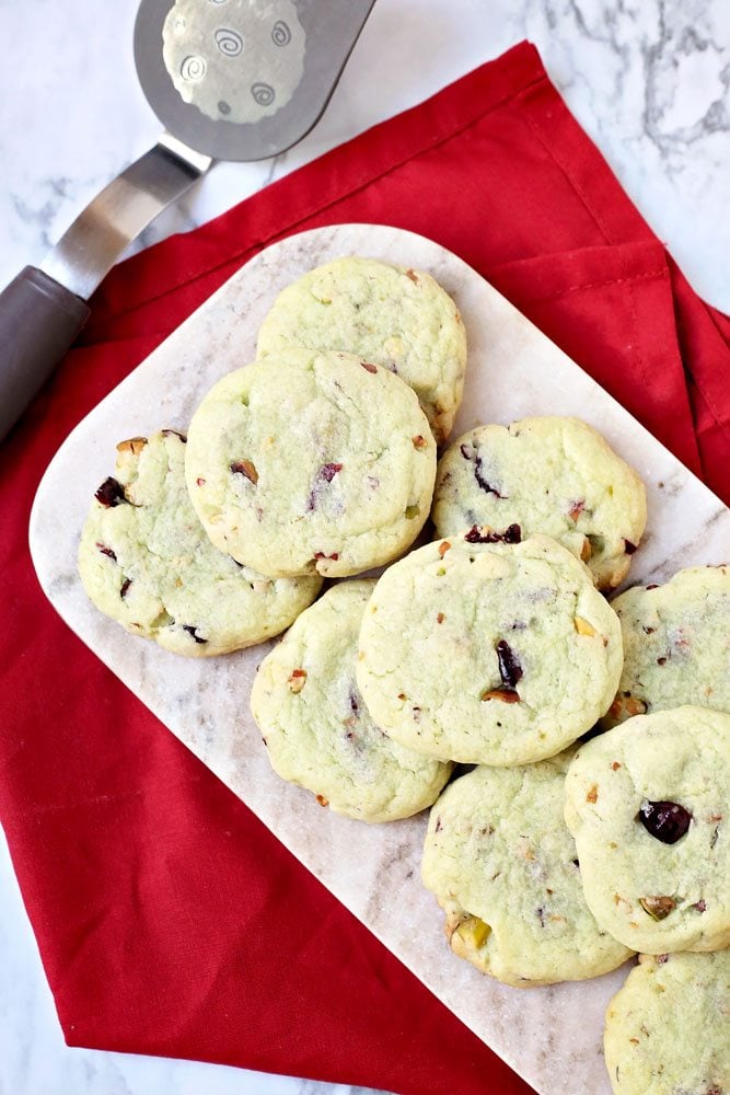 Pistachio cookies on a marble tray.
