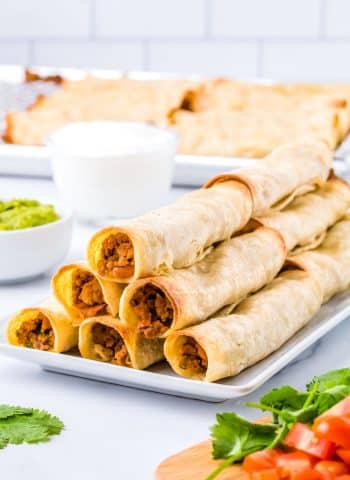 The finished Ground Beef Taquitos piled on each other.