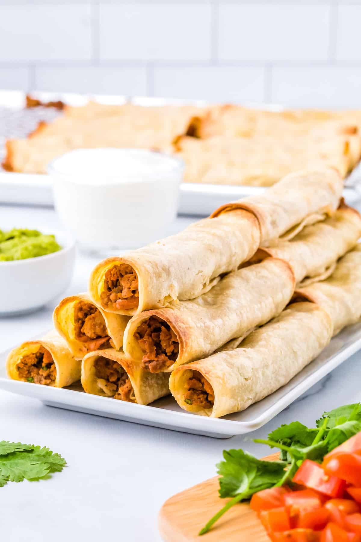 The finished Ground Beef Taquitos piled on each other. 