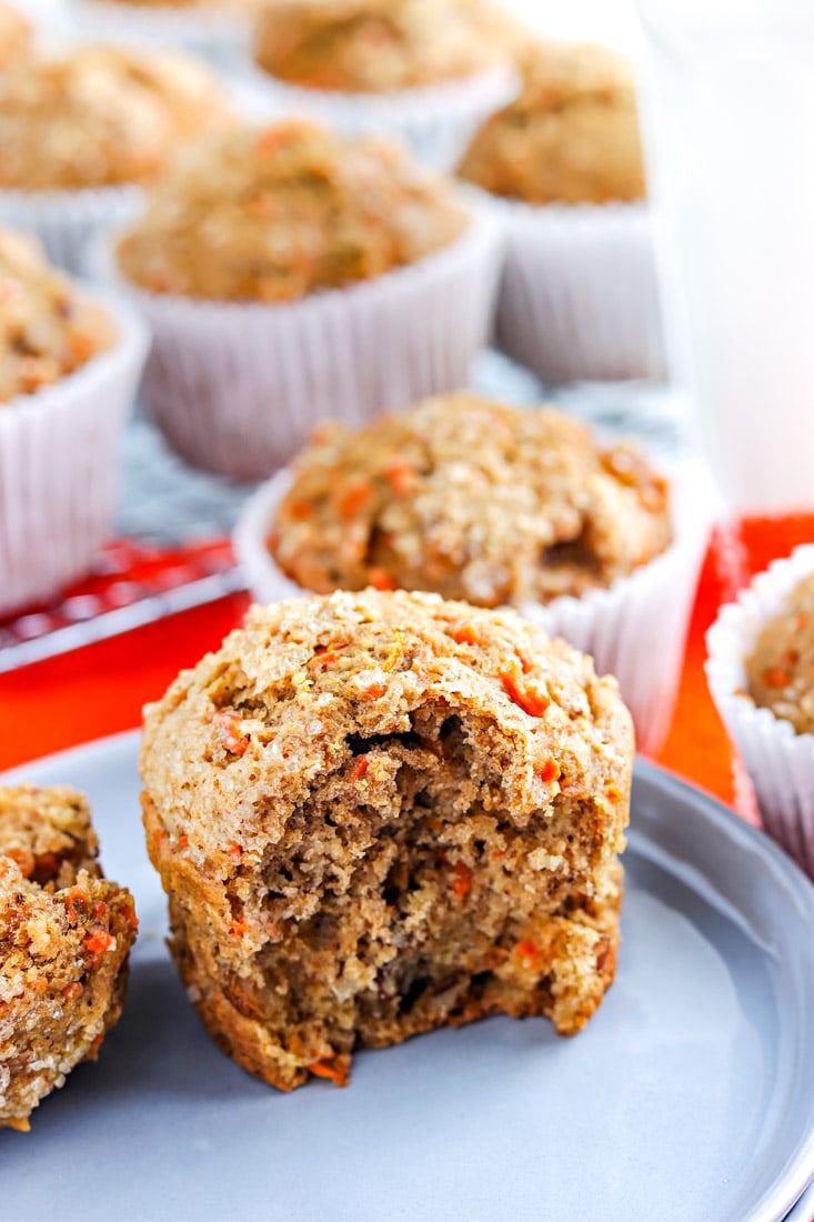 A shut up of carrot cakes, one with a chunk taken out of it so that you just might presumably witness the within.   Healthy Carrot Cake Truffles Recipe Carrot Muffins