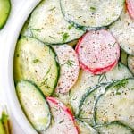 The finished Cucumber Radish Salad in a white serving bowl.