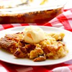 Apple Dump Cake is an easy and irresistible Fall dessert that's made with just 4 ingredients: apple pie filling, cake mix, pecans, and butter!