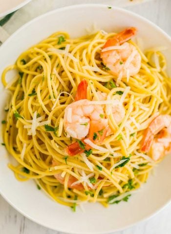 An overhead picture of Shrimp Scampi in a white bowl.