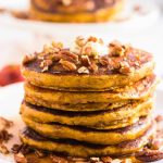 A plate of stacked pumpkin pancakes
