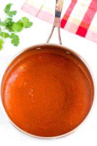 Finished enchilada sauce in a saucepan.