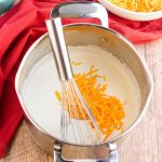 Making cheese sauce for mac and cheese