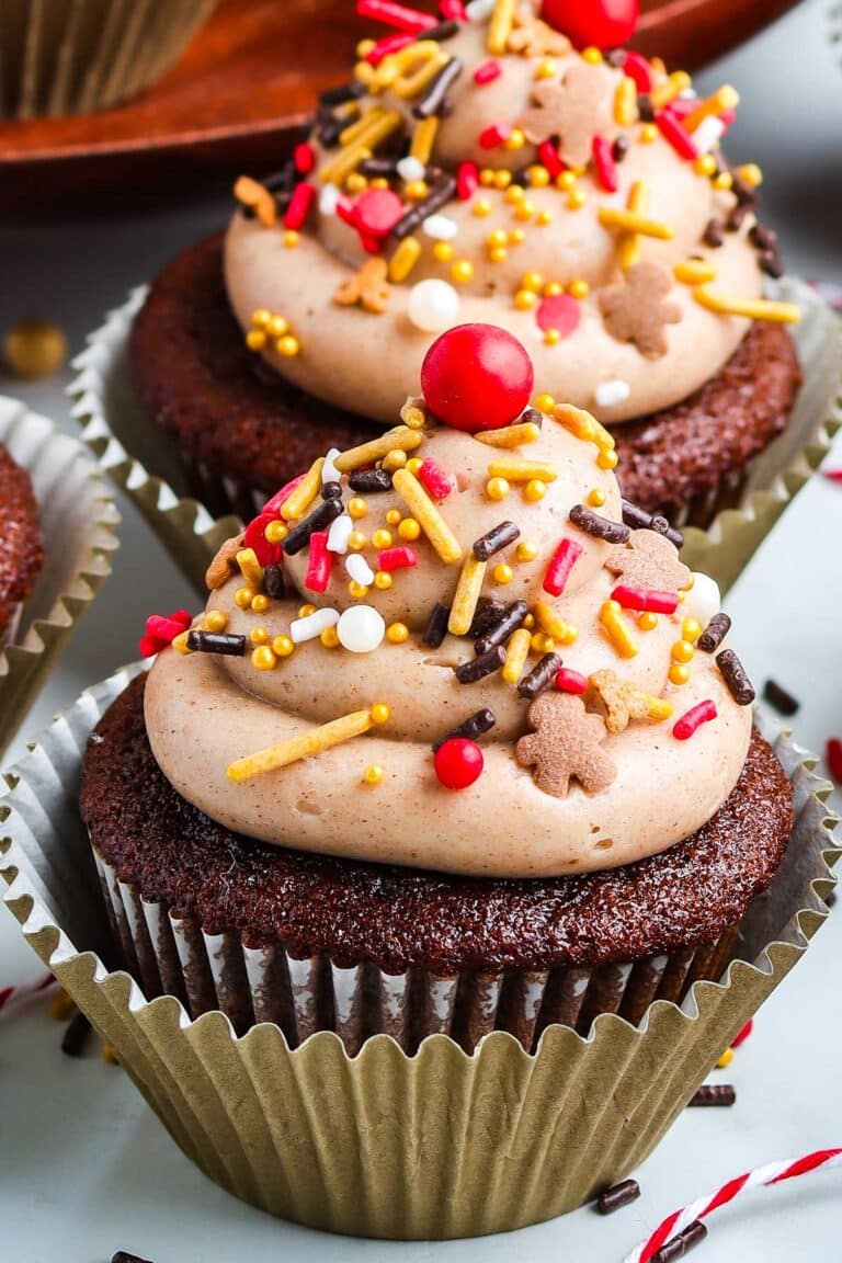 Gingerbread Cupcakes with cinnamon cream cheese frosting and christmas sprinkles.