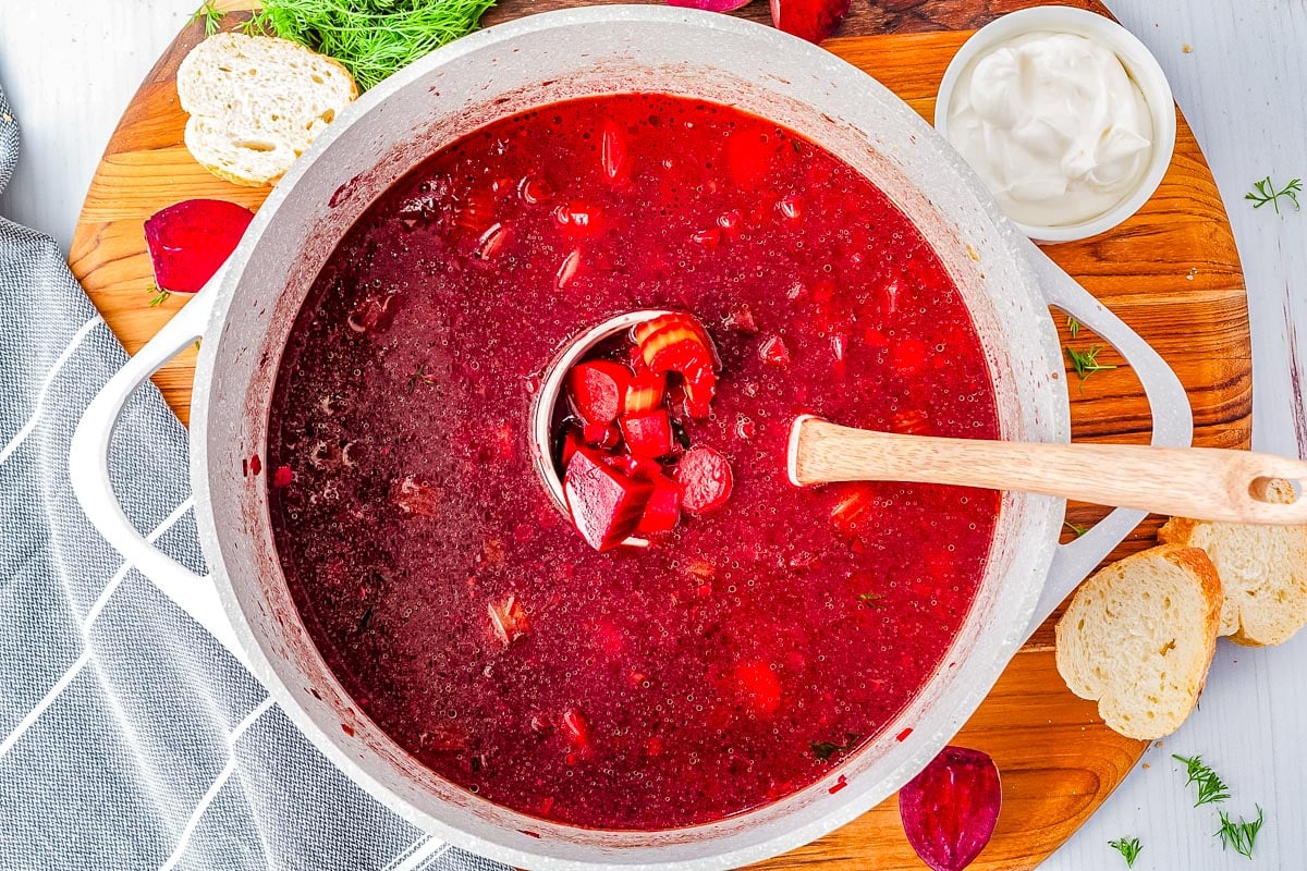 A ladel in a soup pot with the Barszcz.