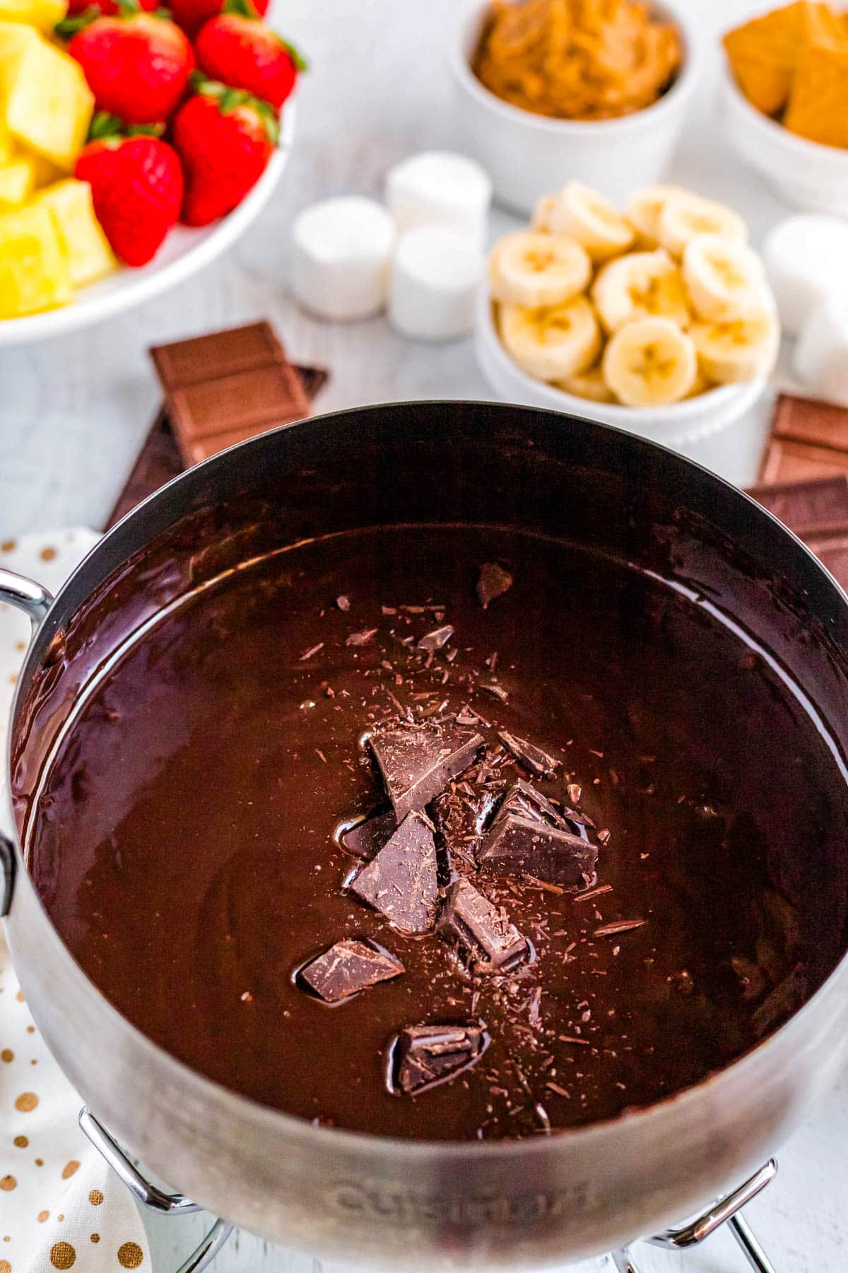 Chocolate being added to the fondue.