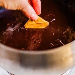 A graham cracked dunked int he finished Melting Pot Chocolate Fondue recipe.