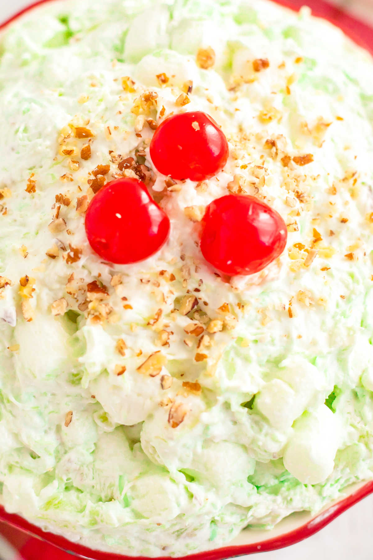 This Pistachio Salad is a fluffy and creamy Watergate salad that is easy to whip up and tastes even better the second day! It’s perfect for St. Patrick’s Day, Easter, Thanksgiving, Christmas, or anytime you’re craving a pistachio dessert!  via @foodfolksandfun