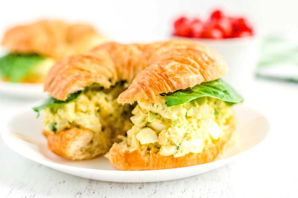 An Egg Salad Sandwich where a croissant is used for the bread. 