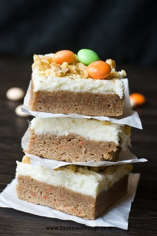 Carrot Cake bar cookies stacked on top of each other.
