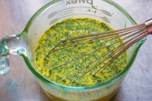 Whisk together the milk, eggs, and dill.