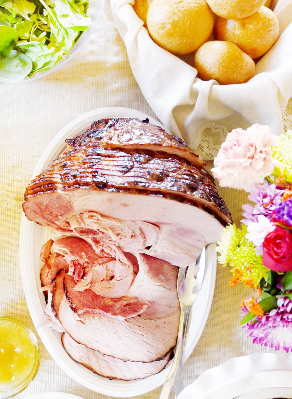 A sliced ham on a plate