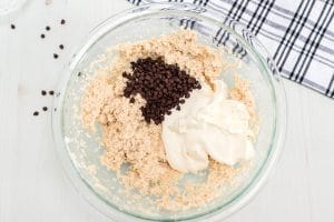 Fold the whipped cream and chocolate chips into the ricotta cheese mixture,